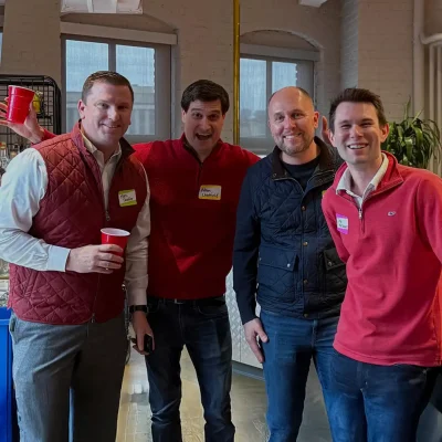 four-guys-taking-photo-at-networking-event